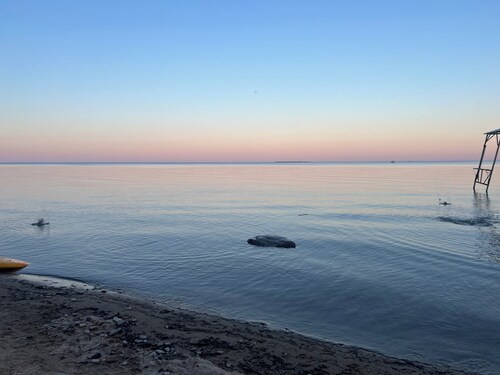 Lake Huron view just a minute walk to private sandy beach.