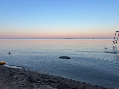 Lake Huron view just a minute walk to private sandy beach.