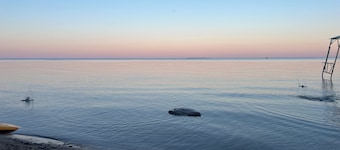 Lake Huron view just a minute walk to private sandy beach.