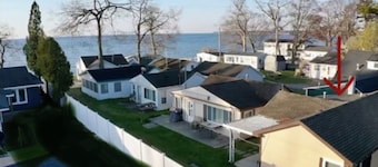 Lake Huron view just a minute walk to private sandy beach.