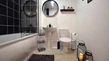 Combined shower/bathtub, hair dryer, towels, soap