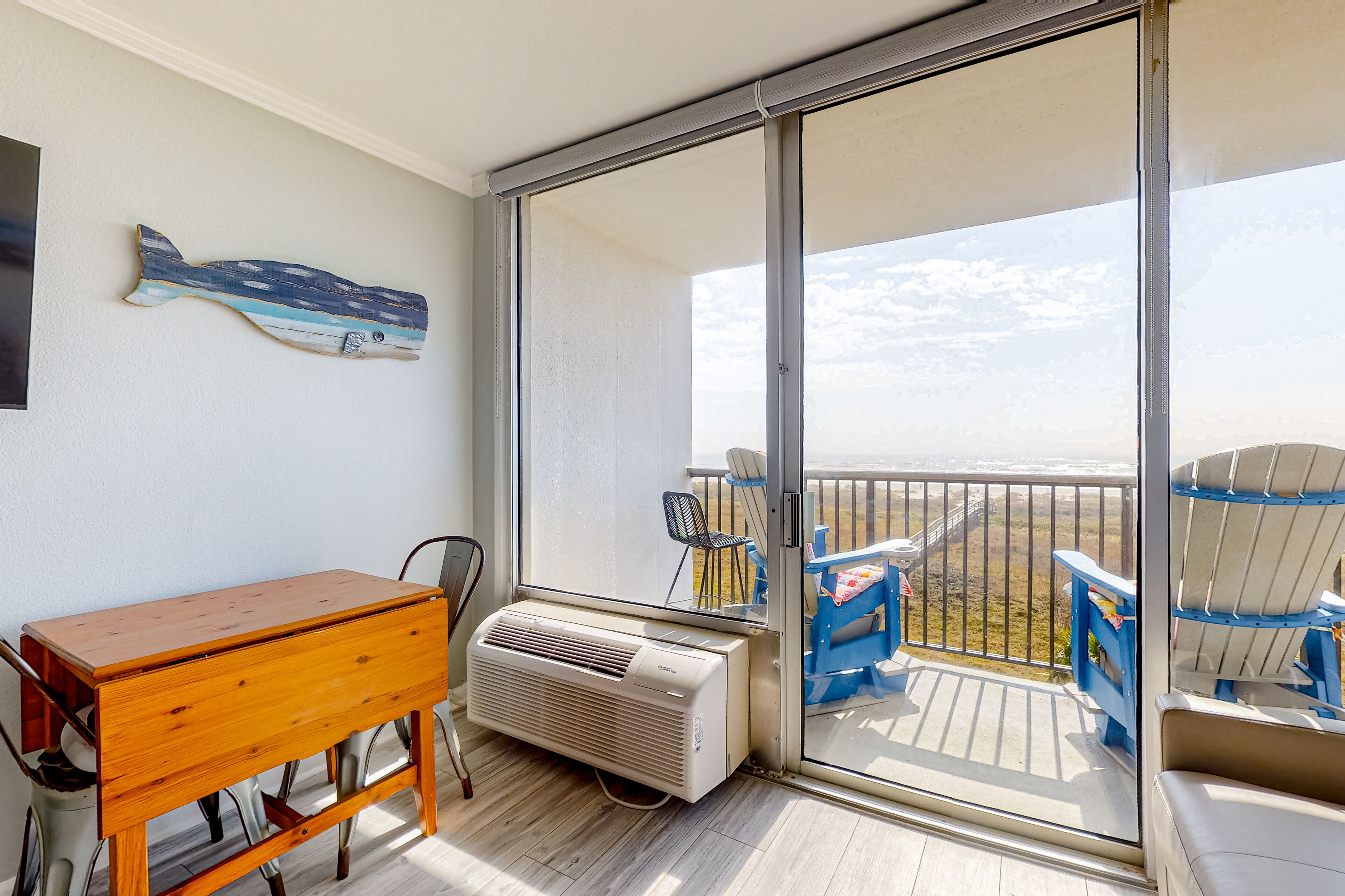 Beachfront condo with fast WiFi, balcony, onsite pool, tennis, & beach access