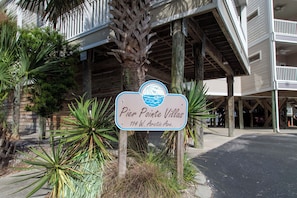 A sign for Pier Pointe Villas at 114 W. Arctic Ave. - Ocean Views & Central location~ Pier Point Villas B202 (Folly Beach)