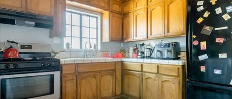 Microwave, coffee/tea maker, cookware/dishes/utensils