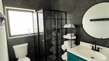 Shower, hair dryer, towels, soap