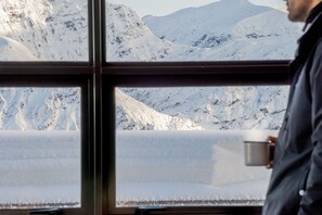 A window with a view of snow-covered mountains. - Exclusive Alpine Chalet overlooking Mt Aspiring National Park (Wanaka)