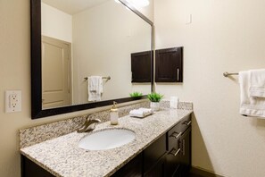Bathtub, hair dryer, towels, soap