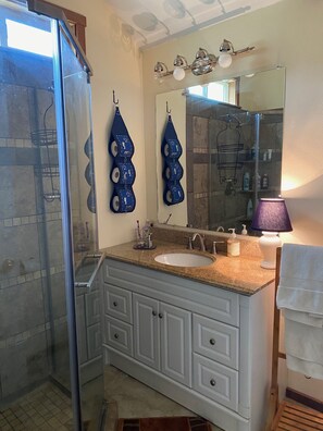 Shower, hair dryer, towels, soap