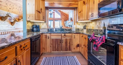 Modern cabin w/ loaded game room, hot tub, stunning views!