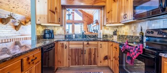 Modern cabin w/ loaded game room, hot tub, stunning views!
