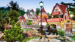 A building with a sign reading "Ellen Square" and a bear statue in front. - Private Sunset-view Cabin • Hot Tub • Sauna • Game Room • Dog-friendly (Blairsville)