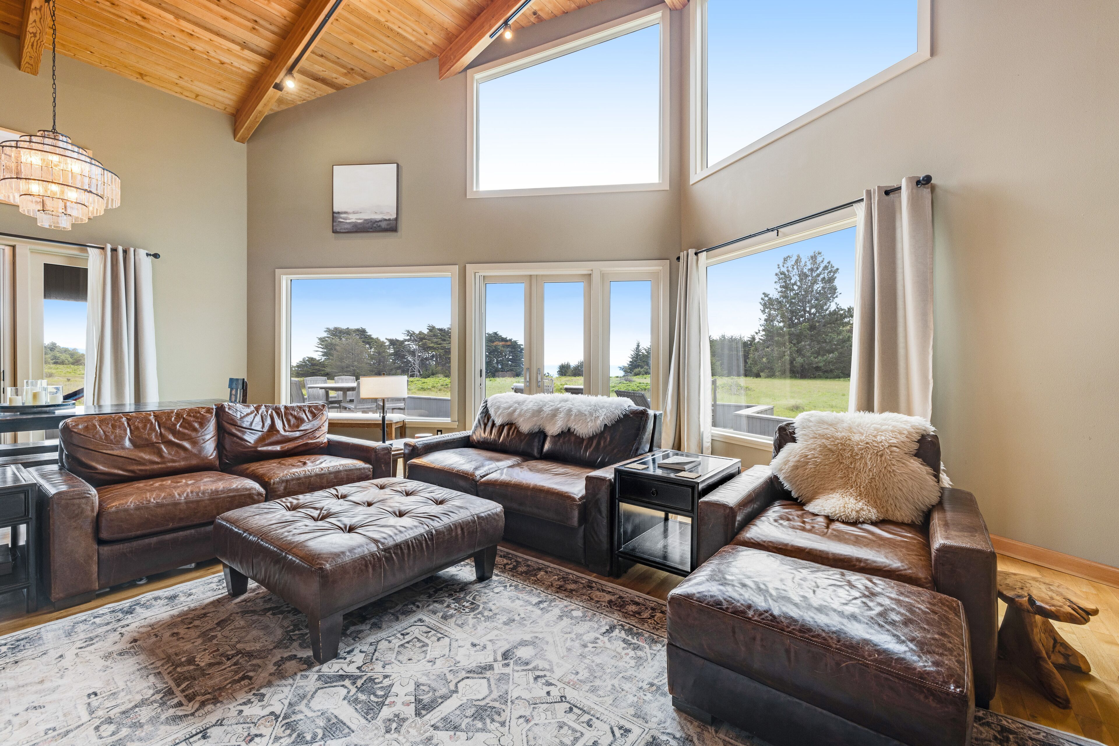 Enjoy a private hot tub, deck, distant ocean view, fireplace, and pool