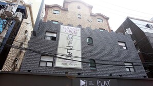 A building with a sign for 'Grand Open' and 'The Play' hotel. - Bucheon THE Play (Bucheon)