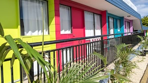 A colorful building with a sign that reads "COAST MOTEL". - Coast Motel Eden (Eden)