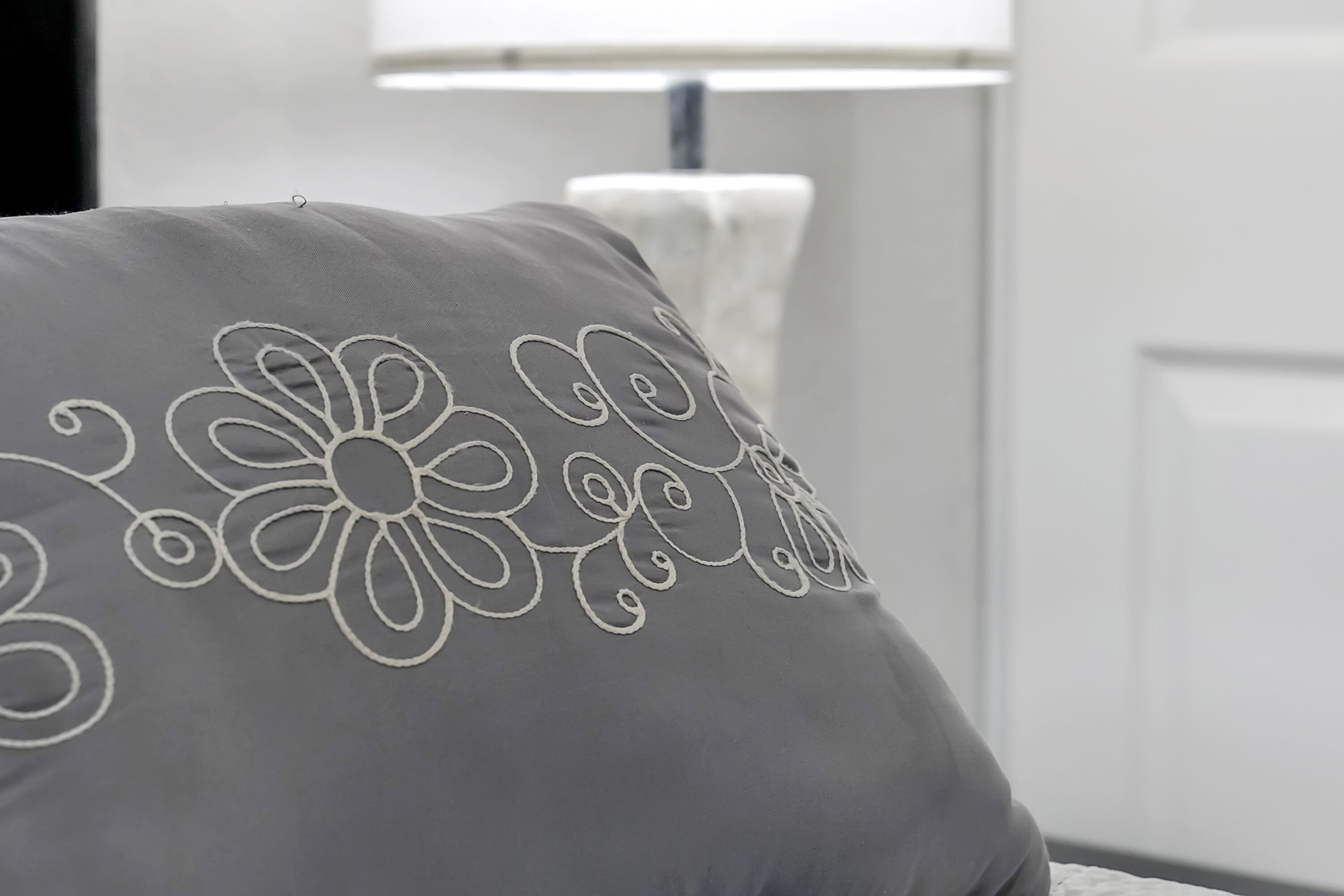 A pillow with a floral pattern.