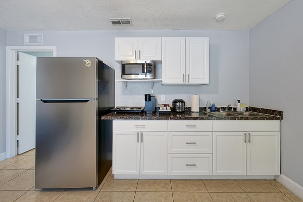 Fridge, microwave, stovetop, coffee/tea maker