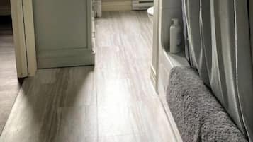 Combined shower/tub, hair dryer, towels, soap