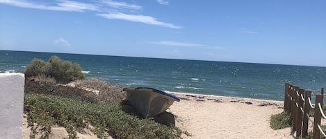 On the beach, sun loungers
