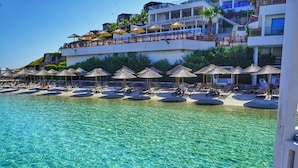 Private beach, white sand, free beach cabanas, sun loungers