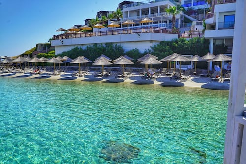 Private beach, white sand, free beach cabanas, sun-loungers