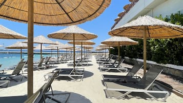 Private beach, white sand, free beach cabanas, sun loungers