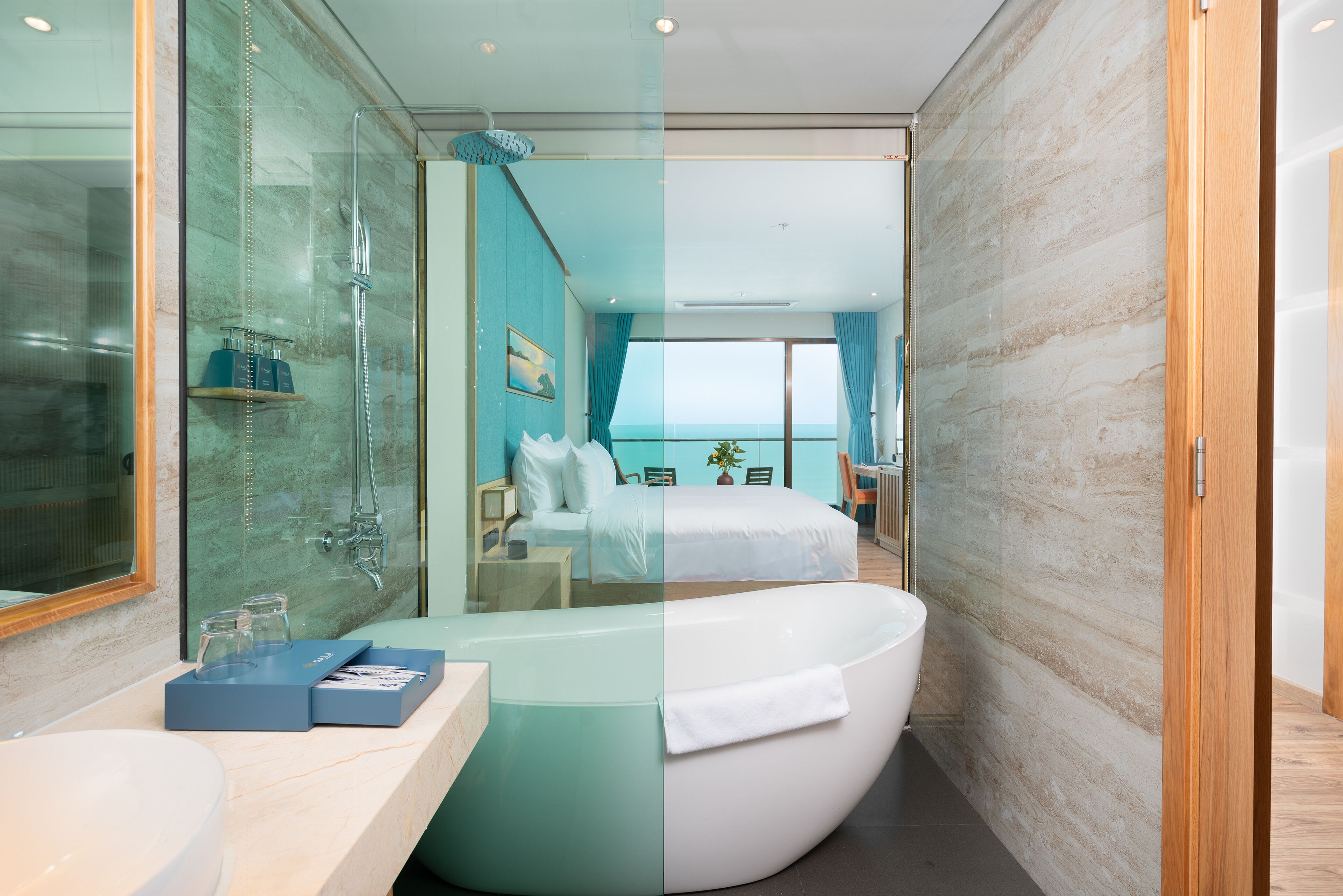 A modern bathroom with a freestanding bathtub, a glass-enclosed shower, and a large mirror.