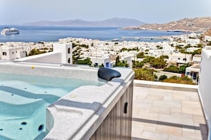 Relax on the rooftop terrace with a hot tub overlooking the coastal town and sea.