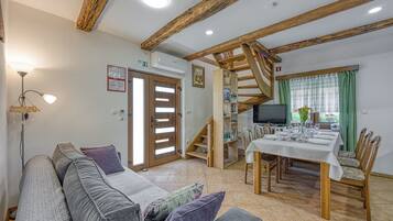 Family House, Multiple Bedrooms, Mountainside (Merry's Spa & Relax House) | Living area | 21-inch flat-screen TV with digital channels, TV, fireplace