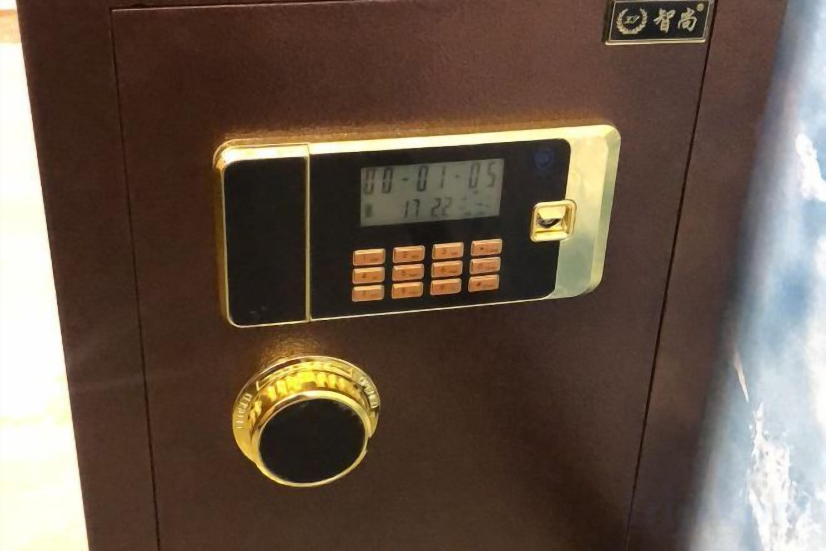 A digital lock with a keypad and a dial combination lock on a brown door.