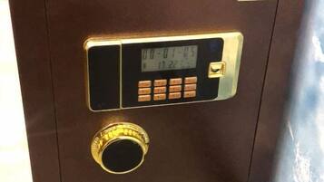 A digital lock with a keypad and a dial combination lock on a brown door.