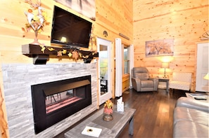 Smart TV, fireplace, books, music library