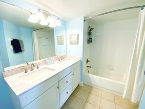 Combined shower/bathtub, hair dryer, towels, soap