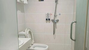 A small, enclosed bathroom with a toilet, a shower, and a hand dryer. - Jinhui Hotel (Guangyi Affiliated Hospital Respiratory Medicine Center Tanwei Subway Station) (Guangzhou)
