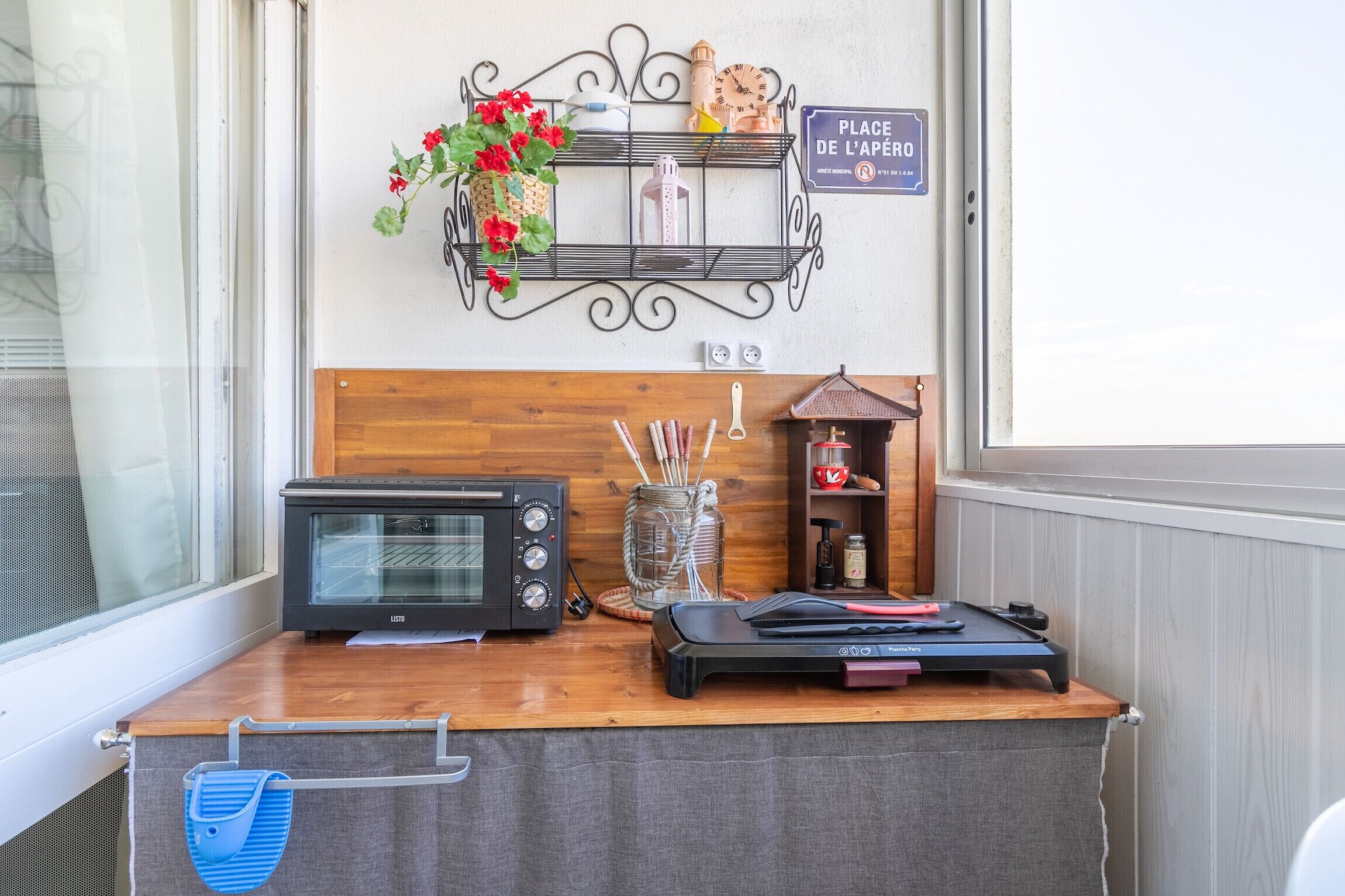 A kitchenette with a microwave, toaster, and coffee maker on a wooden counter.