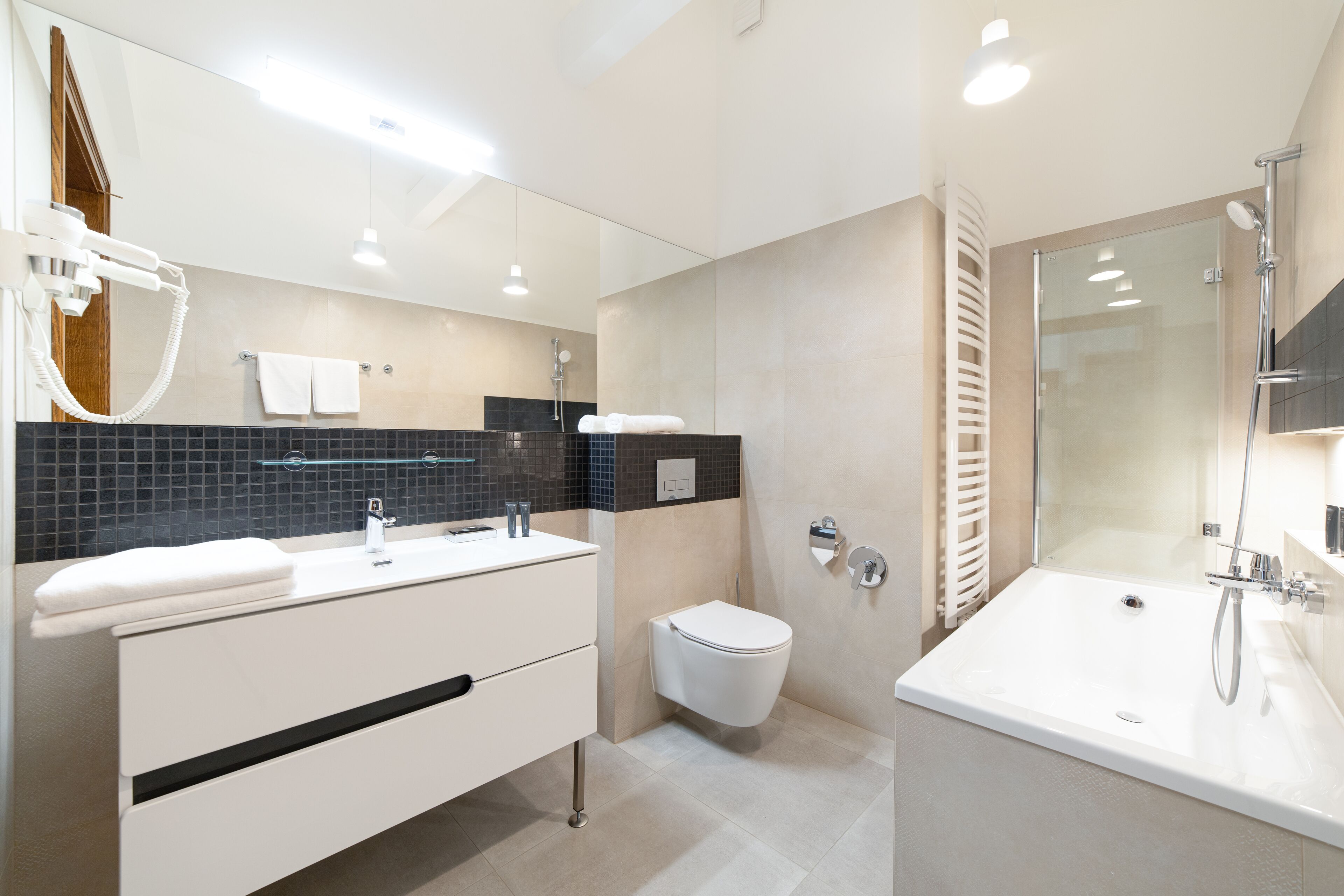 Shower, rainfall showerhead, hair dryer, towels