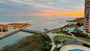 A resort with a large pool, a beach, and a pier. - Recently Renovated Oceanfront Condo, Private Resort +Free Attraction Tickets! (Myrtle Beach)