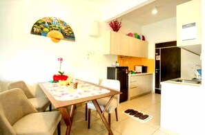 Honeymoon Condo | Private kitchen | Fridge, coffee/tea maker, electric kettle, cookware/dishes/utensils