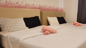 A hotel room with two beds, each with a headboard, and a large window with curtains. - Lcp 1 (Genting Highlands)