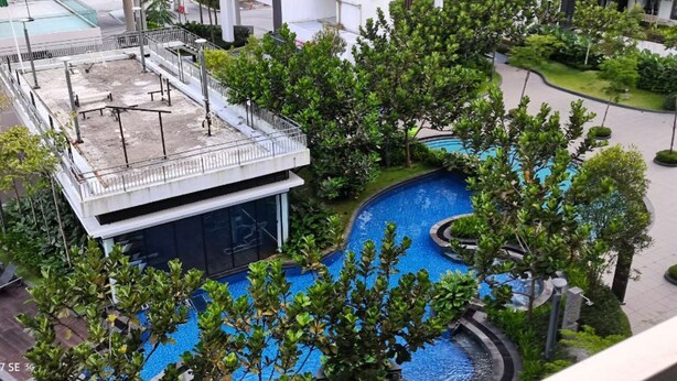 A rooftop pool area with a modern design, surrounded by lush greenery and a covered seating area. - Lcp 1 (Genting Highlands)