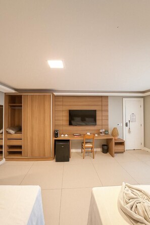 Family Quadruple Room | Minibar, in-room safe, individually decorated, desk