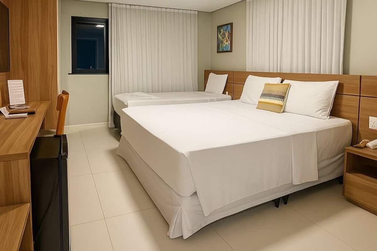 Classic Triple Room | Minibar, in-room safe, individually decorated, desk