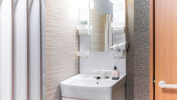 Family Villa | Bathroom | Rainfall showerhead, free toiletries, hair dryer, bidet