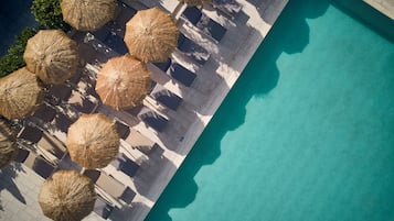 Seasonal outdoor pool, open 9:00 AM to 6:00 PM, pool umbrellas