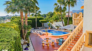A private pool area with a hot tub, lounge chairs, and a staircase leading to a balcony. - Villa AURORA by Abahana Villas (Benissa)
