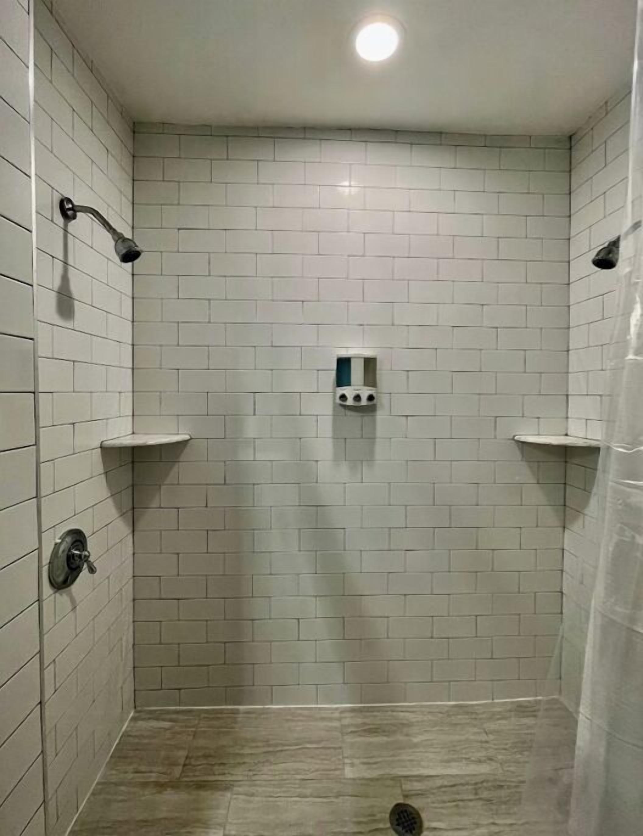 Bathtub, hair dryer, towels, soap