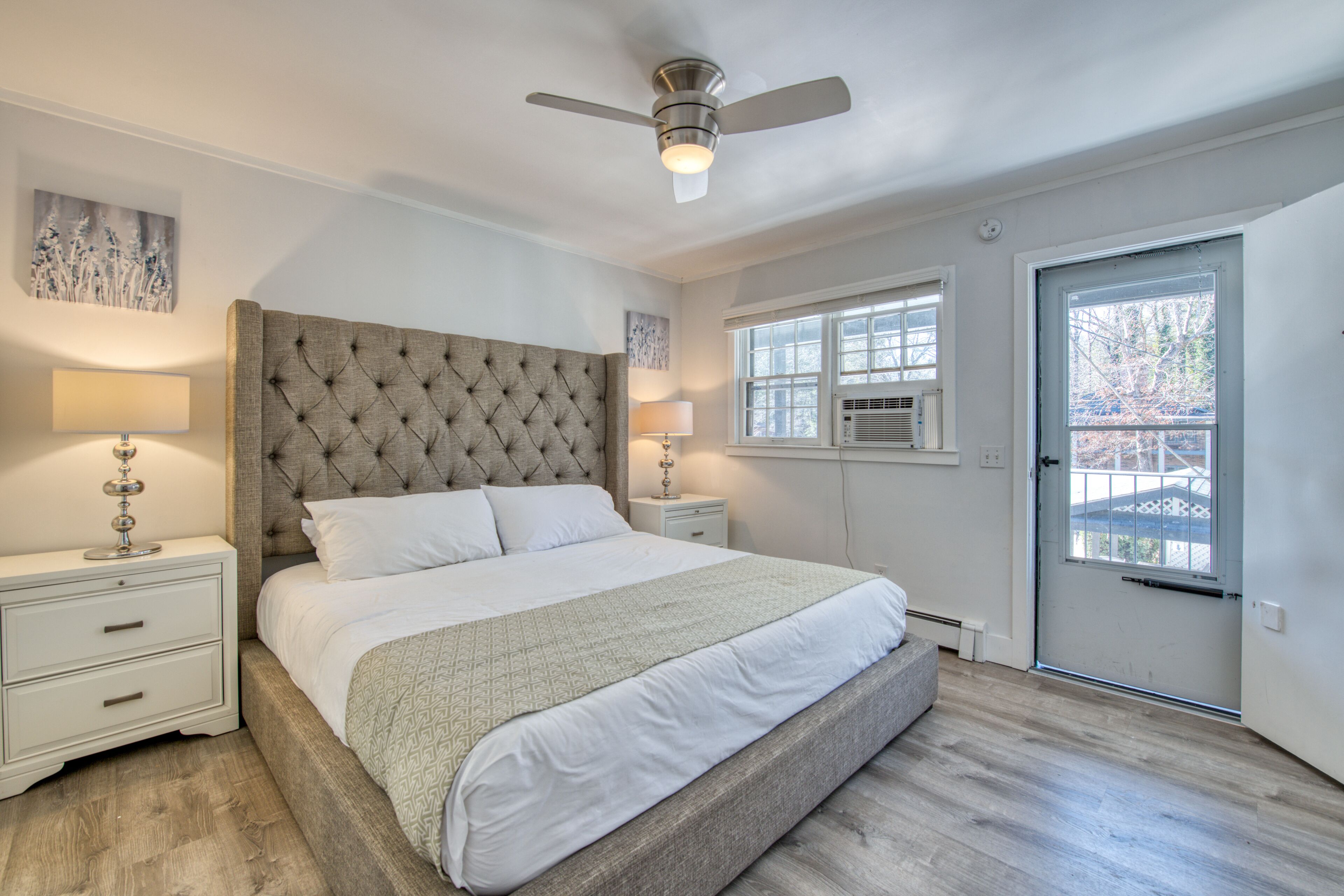 Lakefront corner condo with canoes, resort pool, tennis & firepit - dogs welcome