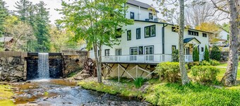 Lakefront corner condo with canoes, resort pool, tennis & firepit - dogs welcome