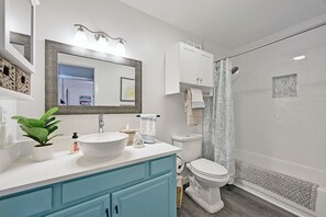 Combined shower/tub, hair dryer, towels, soap