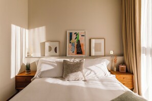 Premium bedding, desk, laptop workspace, iron/ironing board