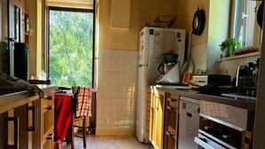 A kitchen with a window, a refrigerator, a stove, and a sink. - Authentic Quercy house, between Périgord and Quercy (Peyrilles)